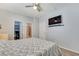 Large bedroom with a closet, bathroom, flat-screen TV, and overhead fan at 1316 Oak Village Ave, Las Vegas, NV 89183