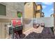 Cozy patio with grill, outdoor seating, and brick pavers at 1316 Oak Village Ave, Las Vegas, NV 89183
