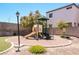 Community playground featuring a slide and climbing structure for children to enjoy outdoors at 1316 Oak Village Ave, Las Vegas, NV 89183