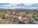 Scenic aerial shot of a residential area with palm trees and views of distant mountains at 1343 Panini Dr, Henderson, NV 89052