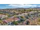 Beautiful aerial view of a vibrant community with tile roofs and lush green landscaping at 1343 Panini Dr, Henderson, NV 89052