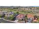 An elevated view of the property showcasing the terracotta roof, desert landscaping and nearby golf course at 1343 Panini Dr, Henderson, NV 89052