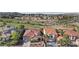 Aerial view of homes near a golf course with lush landscaping, offering a serene living experience at 1343 Panini Dr, Henderson, NV 89052
