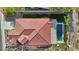 Aerial view of a home's roof with a built-in, in-ground pool in the backyard, next to the house at 1343 Panini Dr, Henderson, NV 89052