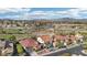 Stunning aerial view of a neighborhood near a golf course, with hills and mountain views at 1343 Panini Dr, Henderson, NV 89052