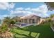 Stunning backyard with manicured lawn, pool, and covered patio perfect for outdoor living at 1343 Panini Dr, Henderson, NV 89052