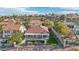 A picturesque backyard features a swimming pool, well-manicured lawn, and a covered outdoor patio area at 1343 Panini Dr, Henderson, NV 89052