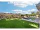 Expansive backyard featuring green artificial turf and a sparkling swimming pool at 1343 Panini Dr, Henderson, NV 89052