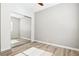 A well lit bedroom features wood floors and a closet with sliding mirror doors at 1343 Panini Dr, Henderson, NV 89052