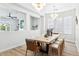 Elegant dining room features a large table, chairs, a pendant light, and wood flooring at 1343 Panini Dr, Henderson, NV 89052