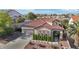 Beautiful single-Gathering home with a well-manicured front yard and tile roof at 1343 Panini Dr, Henderson, NV 89052