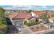 Beautiful single-story home features a terracotta tile roof, desert landscaping, and an attached two car garage at 1343 Panini Dr, Henderson, NV 89052