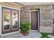 Welcoming front entrance with stone accents, double doors, and stylish lighting creates great curb appeal at 1343 Panini Dr, Henderson, NV 89052