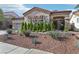 Well-maintained single-story home with desert landscaping, tile roof, a three-car garage and inviting front entrance at 1343 Panini Dr, Henderson, NV 89052