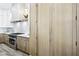 Bright kitchen features stainless steel appliances and custom cabinets for a modern design at 1343 Panini Dr, Henderson, NV 89052