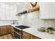 Modern kitchen with stainless steel appliances, granite countertops, and ample cabinet space at 1343 Panini Dr, Henderson, NV 89052