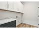 Clean laundry room with modern cabinets and countertop space at 1343 Panini Dr, Henderson, NV 89052