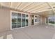 Covered patio with view of backyard pool and palm trees at 1343 Panini Dr, Henderson, NV 89052