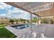 Relaxing backyard oasis with a sparkling pool and covered patio at 1343 Panini Dr, Henderson, NV 89052