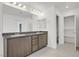 The bright primary bathroom has dual sinks, neutral cabinetry, and a separate toilet room at 1388 Graphite Ave, Henderson, NV 89002