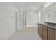 The bright, spacious bathroom features a shower, soaking tub, and vanity with neutral cabinetry at 1388 Graphite Ave, Henderson, NV 89002