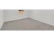 This empty bedroom boasts neutral carpeting, white walls, and great natural light from a large window at 1388 Graphite Ave, Henderson, NV 89002