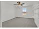 A bright bedroom boasts a ceiling fan, natural light, and a wall of shelving at 1388 Graphite Ave, Henderson, NV 89002