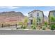 Charming home featuring a desert landscaped front yard, complemented by mountain views at 1388 Graphite Ave, Henderson, NV 89002