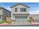 Charming home boasts a two-car garage, neutral colors, and low-maintenance landscaping at 1388 Graphite Ave, Henderson, NV 89002