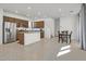 A spacious, well-lit kitchen that flows into the dining area with modern stainless steel appliances at 1388 Graphite Ave, Henderson, NV 89002