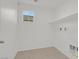 A practical laundry room with storage shelf offers convenience and functionality at 1388 Graphite Ave, Henderson, NV 89002
