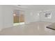 Living room with sliding glass doors providing ample natural light and access to the backyard at 1388 Graphite Ave, Henderson, NV 89002