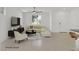 Bright living room with neutral tones, ceiling fan, and lots of natural light at 1388 Graphite Ave, Henderson, NV 89002