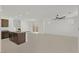 Open concept living room with tile floors, ceiling fan, and access to the backyard at 1388 Graphite Ave, Henderson, NV 89002