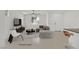 Virtually staged living room with modern furniture, tile floors, and a view of the outdoors at 1388 Graphite Ave, Henderson, NV 89002