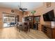 Home bar area with custom wood bar, seating and easy access to backyard patio at 1723 Anchor Dr, North Las Vegas, NV 89032
