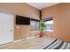 Bright bedroom with natural light and wood-look floors at 1723 Anchor Dr, North Las Vegas, NV 89032