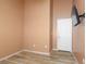 Bedroom with neutral walls and wood-look flooring at 1723 Anchor Dr, North Las Vegas, NV 89032