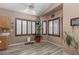 Bright dining area with wood shutters, and wood-look tile flooring at 1723 Anchor Dr, North Las Vegas, NV 89032