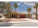 Charming home with a well-maintained front yard and driveway, complemented by mature palm trees at 1723 Anchor Dr, North Las Vegas, NV 89032