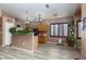 Functional kitchen with wood cabinets, modern appliances, and breakfast bar at 1723 Anchor Dr, North Las Vegas, NV 89032