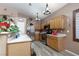 Well-lit kitchen with wood cabinets, stainless steel appliances, and open layout at 1723 Anchor Dr, North Las Vegas, NV 89032