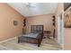 Comfortable main bedroom with wood bed frame and ceiling fan at 1723 Anchor Dr, North Las Vegas, NV 89032
