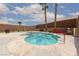 Relaxing backyard with a sparkling pool, tropical palm trees, and plenty of room to enjoy at 1723 Anchor Dr, North Las Vegas, NV 89032