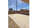 Spacious backyard with a concrete patio and brick perimeter at 1972 H St, Las Vegas, NV 89106