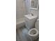 Bathroom with a white vanity, toilet, and tub-shower combo with decorative tile at 1972 H St, Las Vegas, NV 89106
