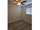 Clean bedroom featuring a ceiling fan, a window with blinds, and updated flooring at 1972 H St, Las Vegas, NV 89106