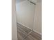 Bedroom with mirrored closet doors and light-colored flooring at 1972 H St, Las Vegas, NV 89106