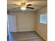 Bedroom with wood-style flooring, a ceiling fan, and a window at 1972 H St, Las Vegas, NV 89106