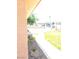 Exterior view of the home's driveway featuring rock landscaping and a privacy fence at 1972 H St, Las Vegas, NV 89106
